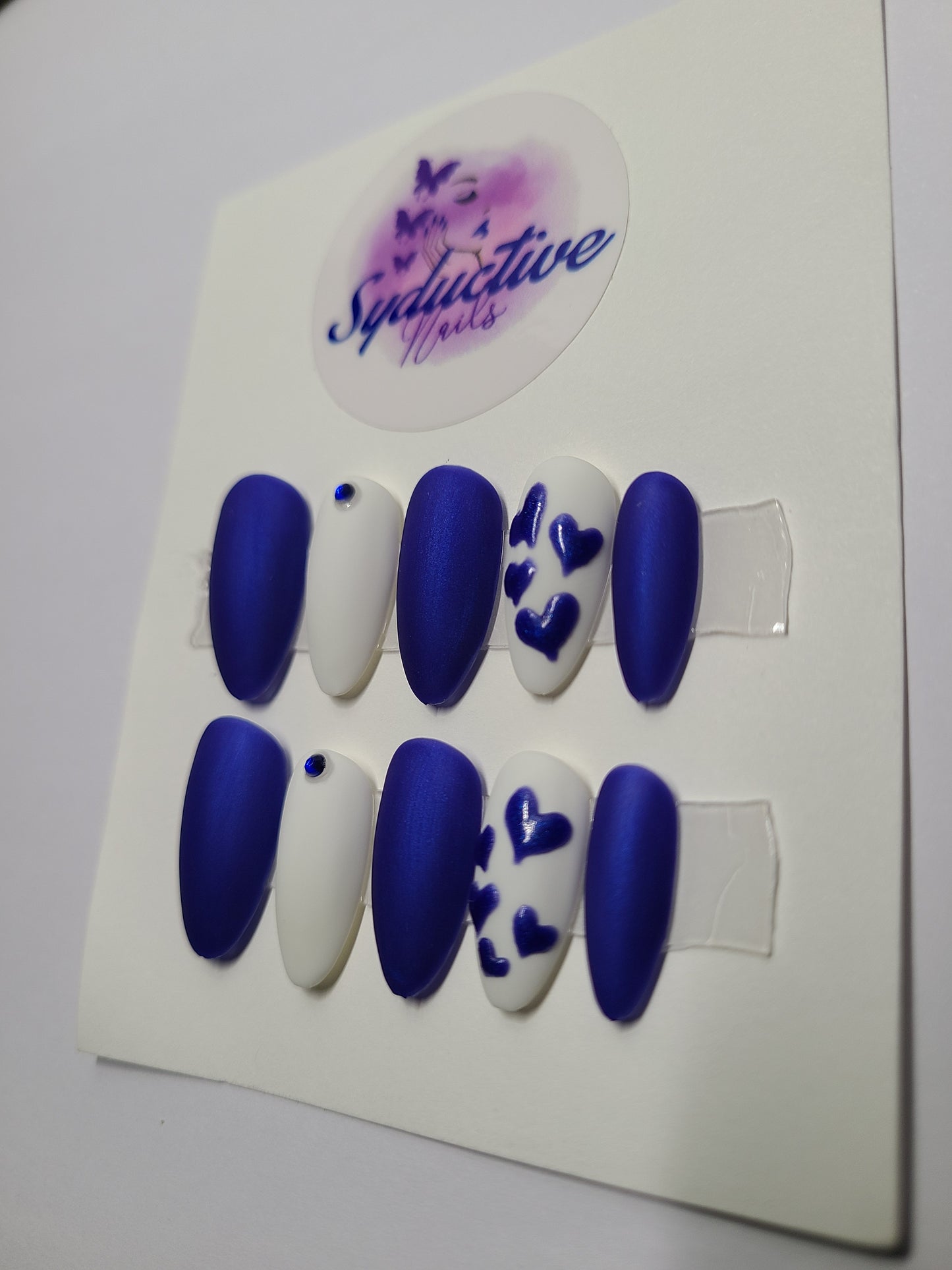 Matte royal blue and white with blue hearts and gems. Medium Almond, (14 pieces) Press-On Nails including Prep Kit (PN000060)