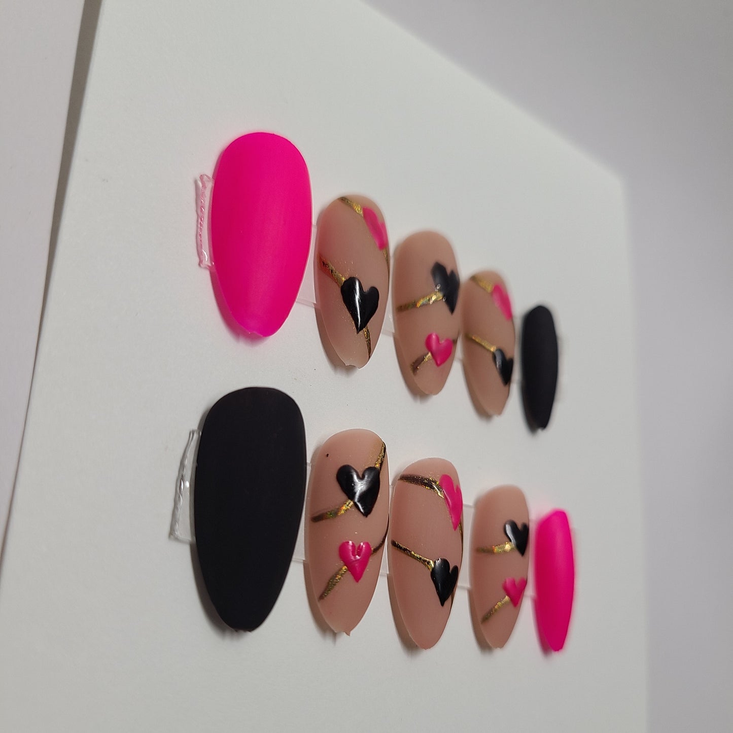 Matte black and pink with hearts and gold lines. Medium Almond, (24 pieces) Press-On Nails including Prep Kit (PN000094)