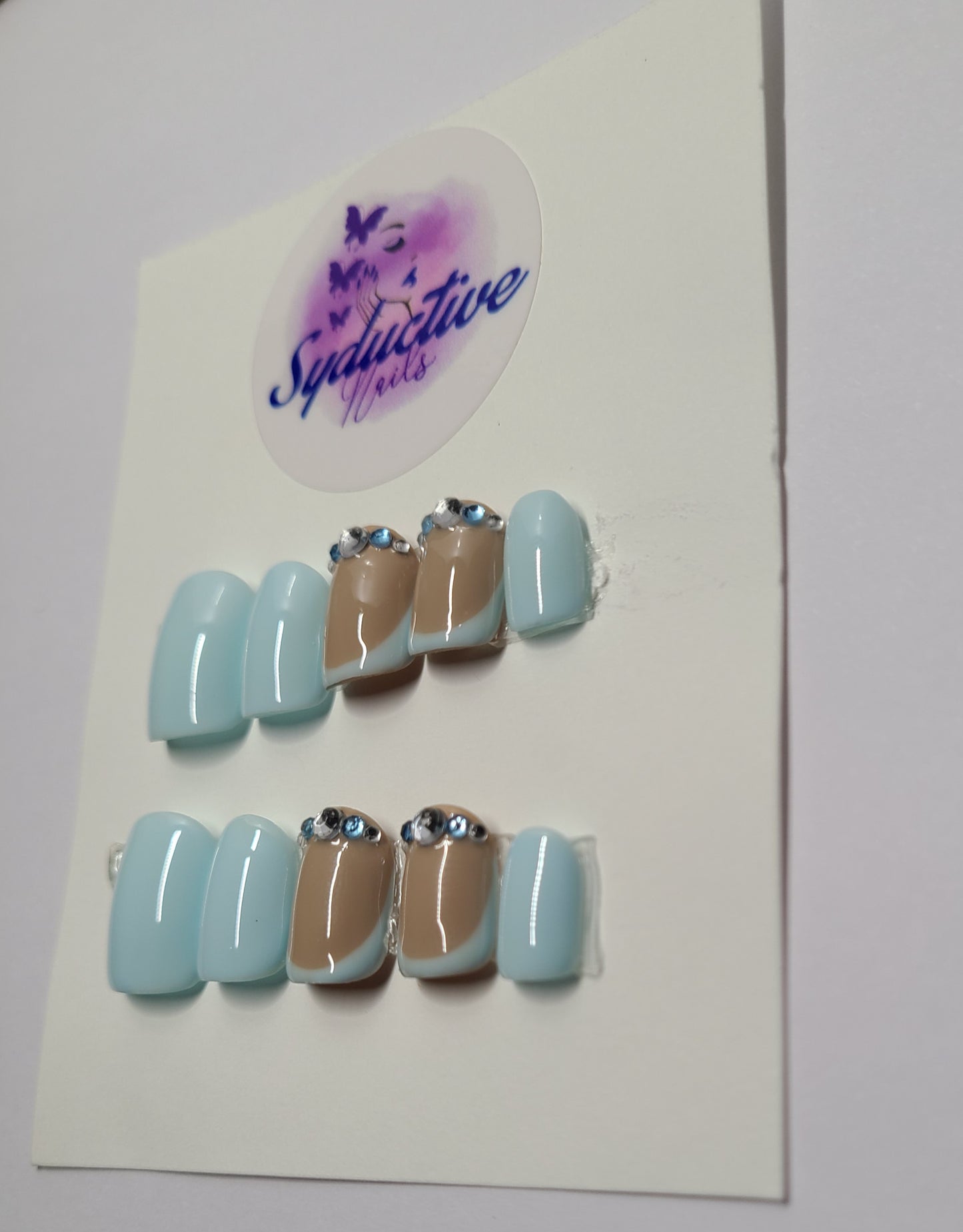 Pale blue French nails with gems on the middle and ring fingers. Short Square, (14 pieces) Press-On Nails including Prep Kit (PN000045)