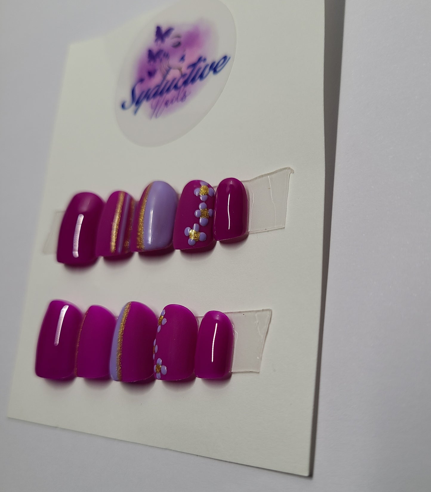 Dark and light purple matte and shiny nails. Accentuated with flowers and gold lines. Short Square, (14 pieces) Press-On Nails including Prep Kit (PN000047)