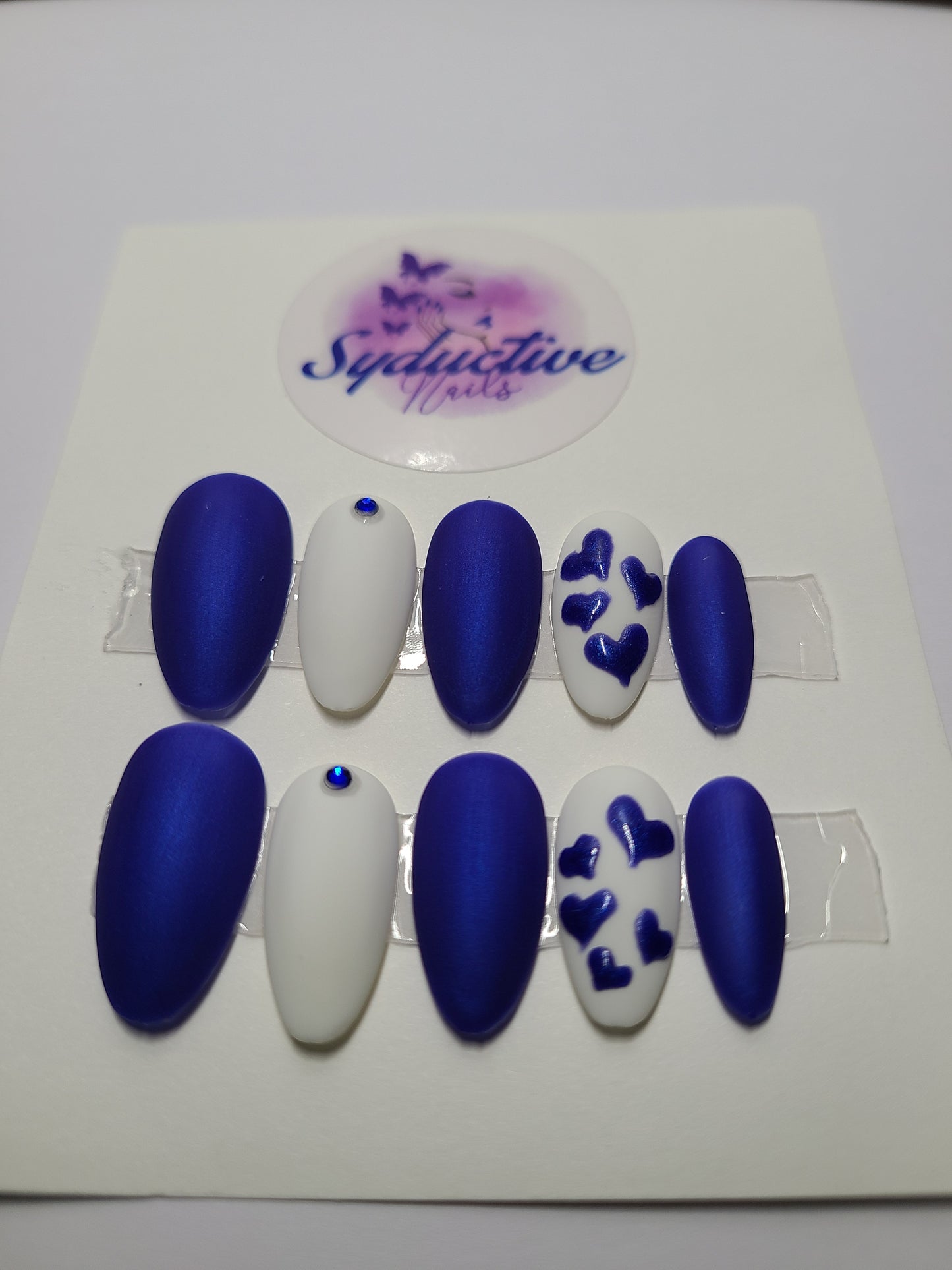 Matte royal blue and white with blue hearts and gems. Medium Almond, (14 pieces) Press-On Nails including Prep Kit (PN000060)