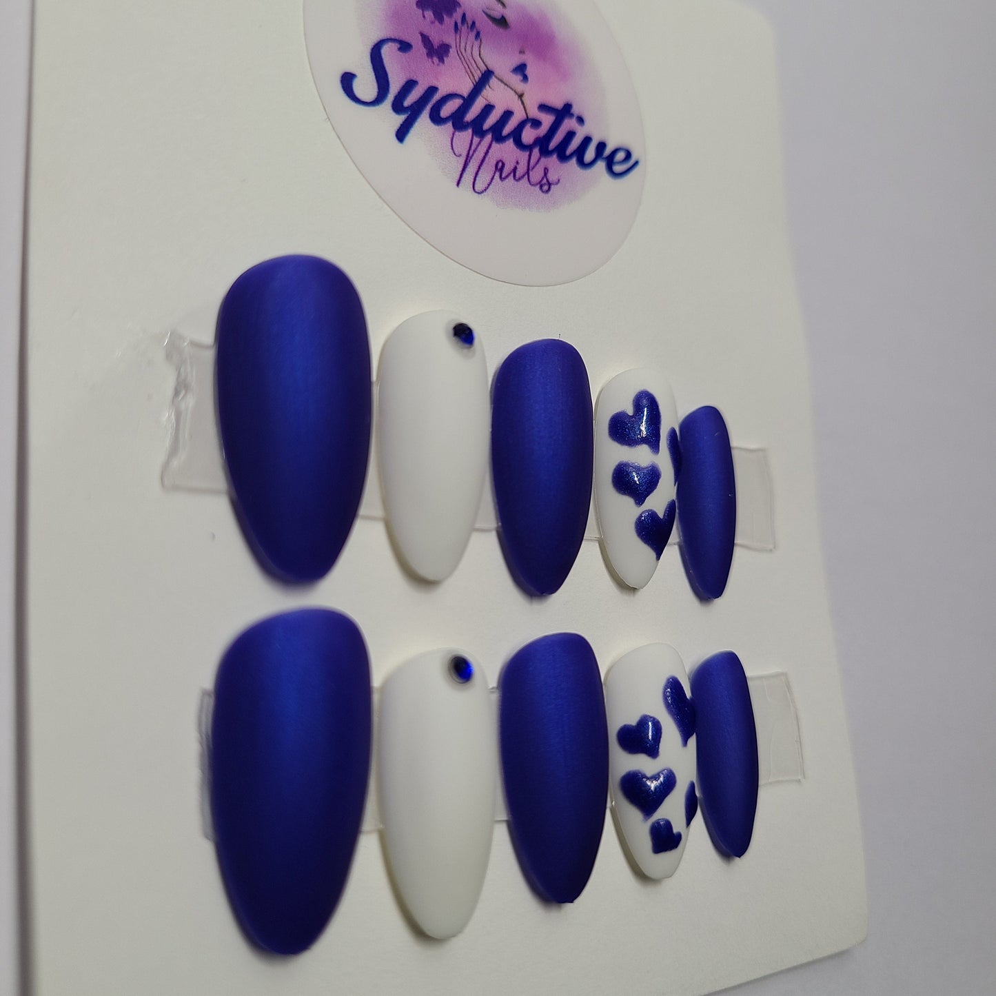 Matte royal blue and white with blue hearts and gems. Medium Almond, (14 pieces) Press-On Nails including Prep Kit (PN000060)