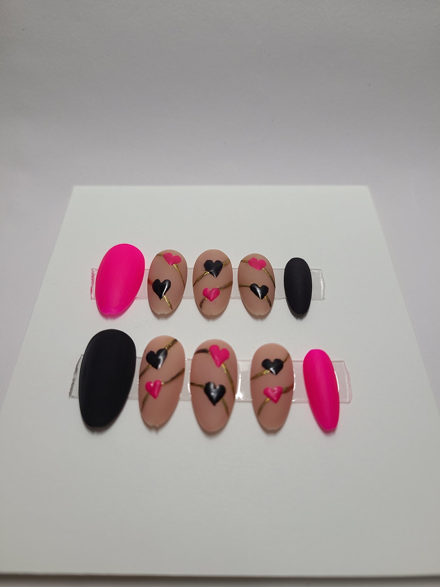 Matte black and pink with hearts and gold lines. Medium Almond, (24 pieces) Press-On Nails including Prep Kit (PN000094)