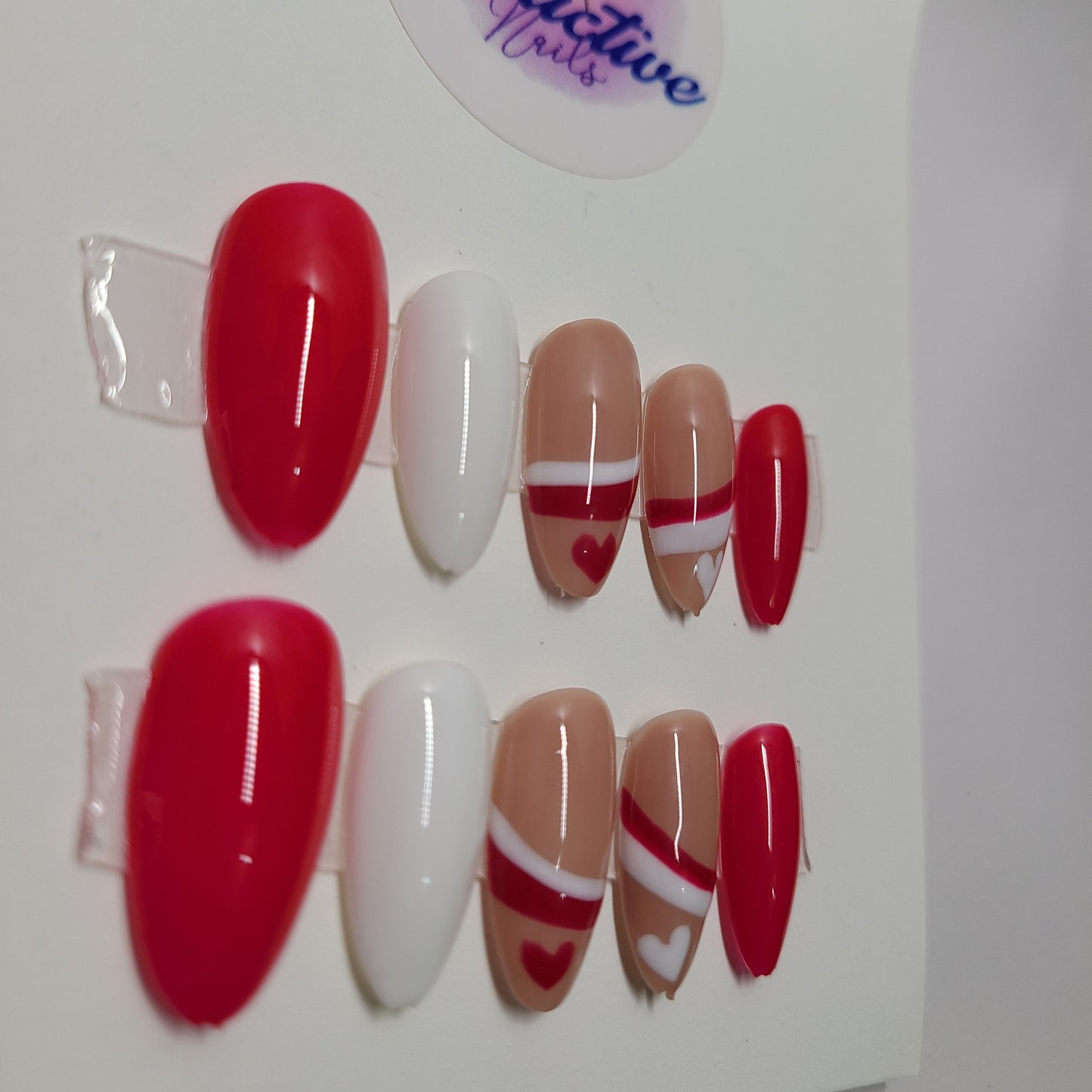 Red and white with lines and hearts. Medium Almond, (24 pieces) Press-On Nails including Prep Kit (PN000095)