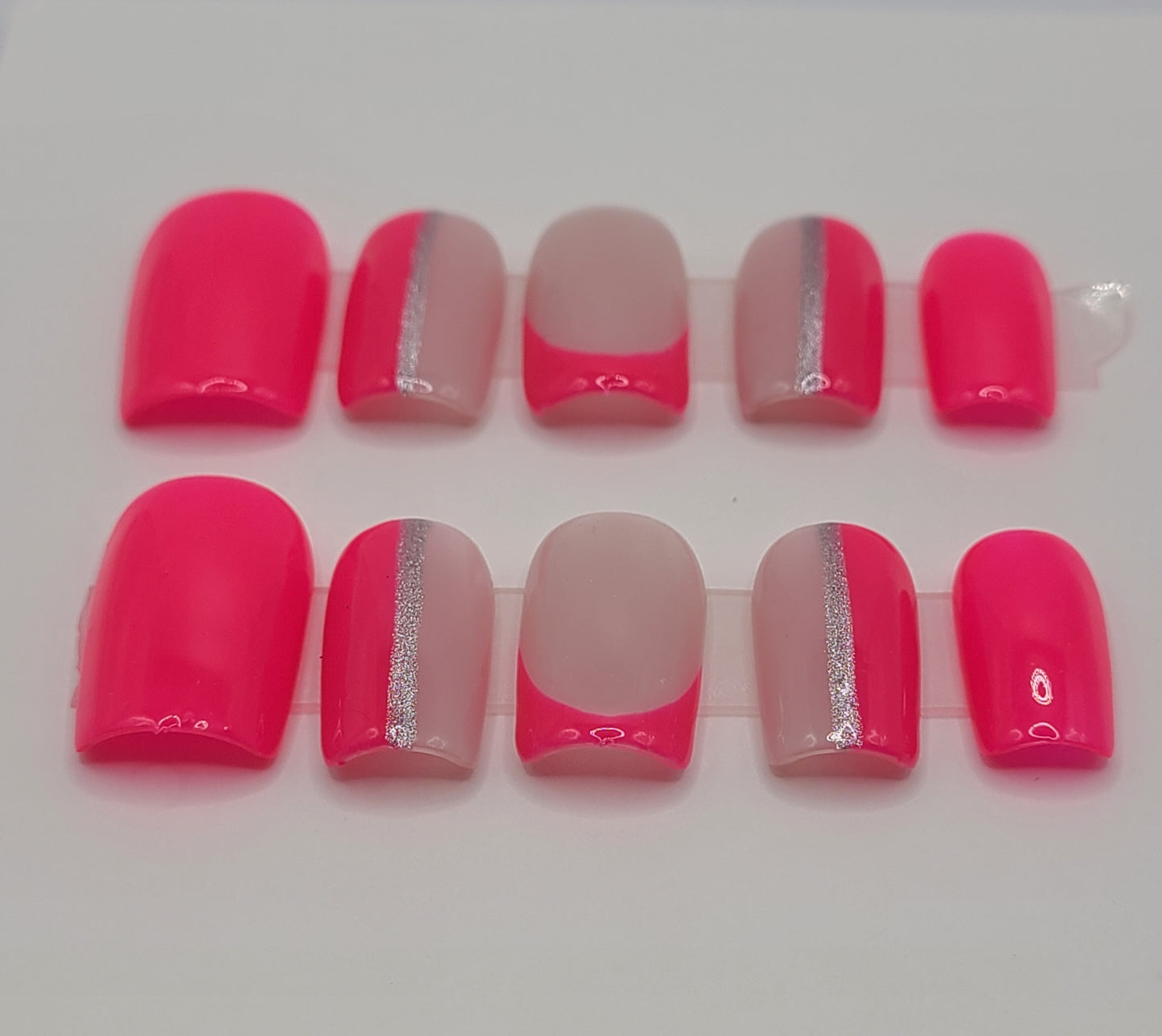 Bright pink multi-design with silver lines. Short Square, (10 pieces) Press-On Nails including Prep Kit
