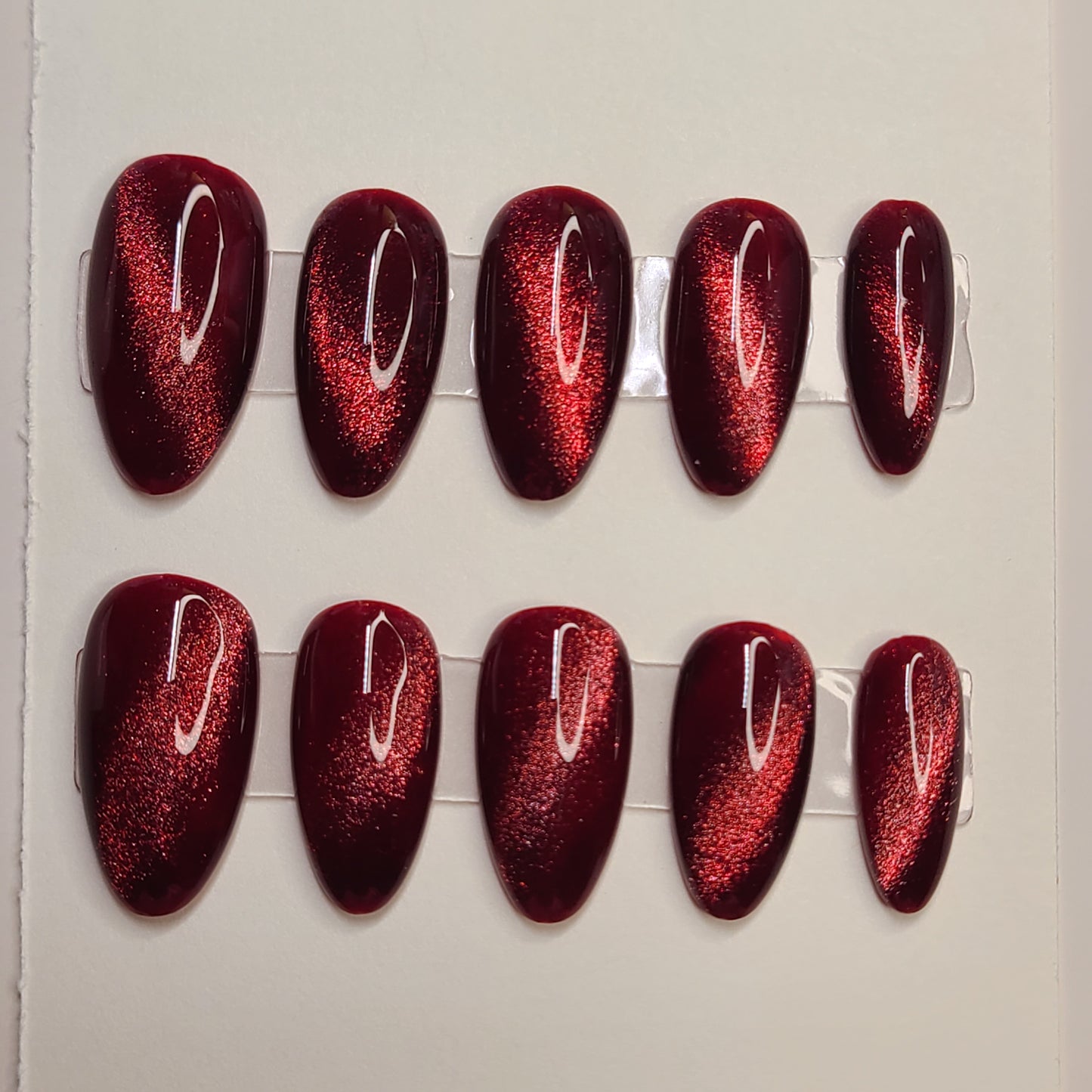 Crimson Eclipse Medium Almond Press-On Nails