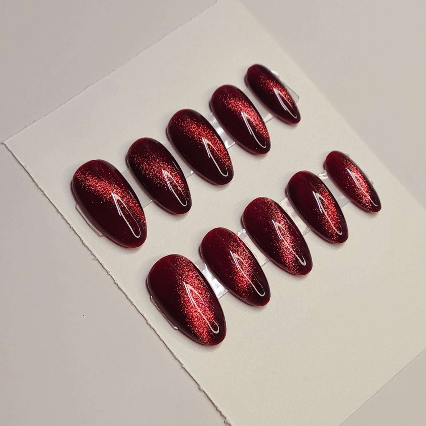 Crimson Eclipse Medium Almond Press-On Nails